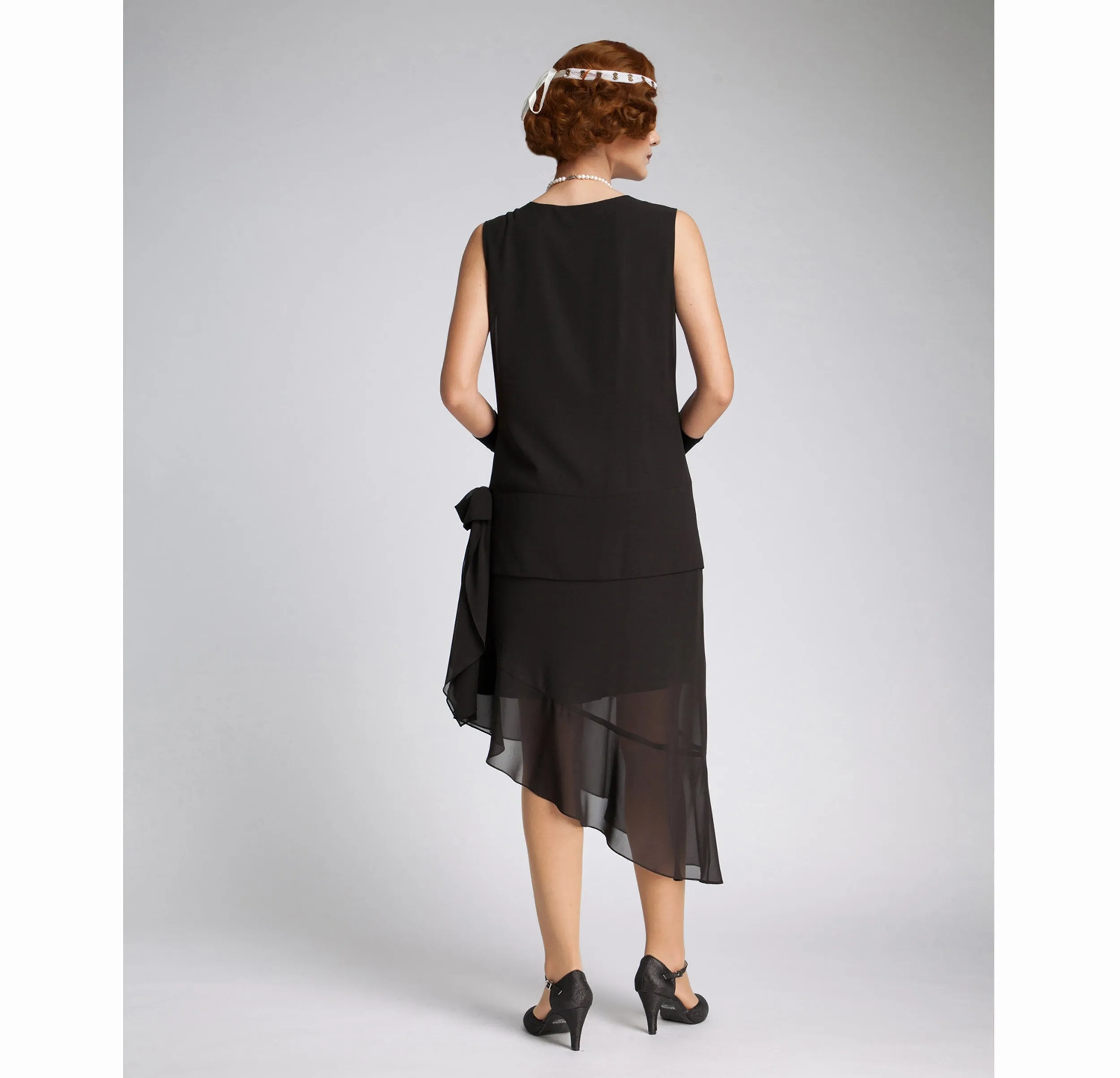 1920s evening dress in black chiffon and asymmetrical skirt