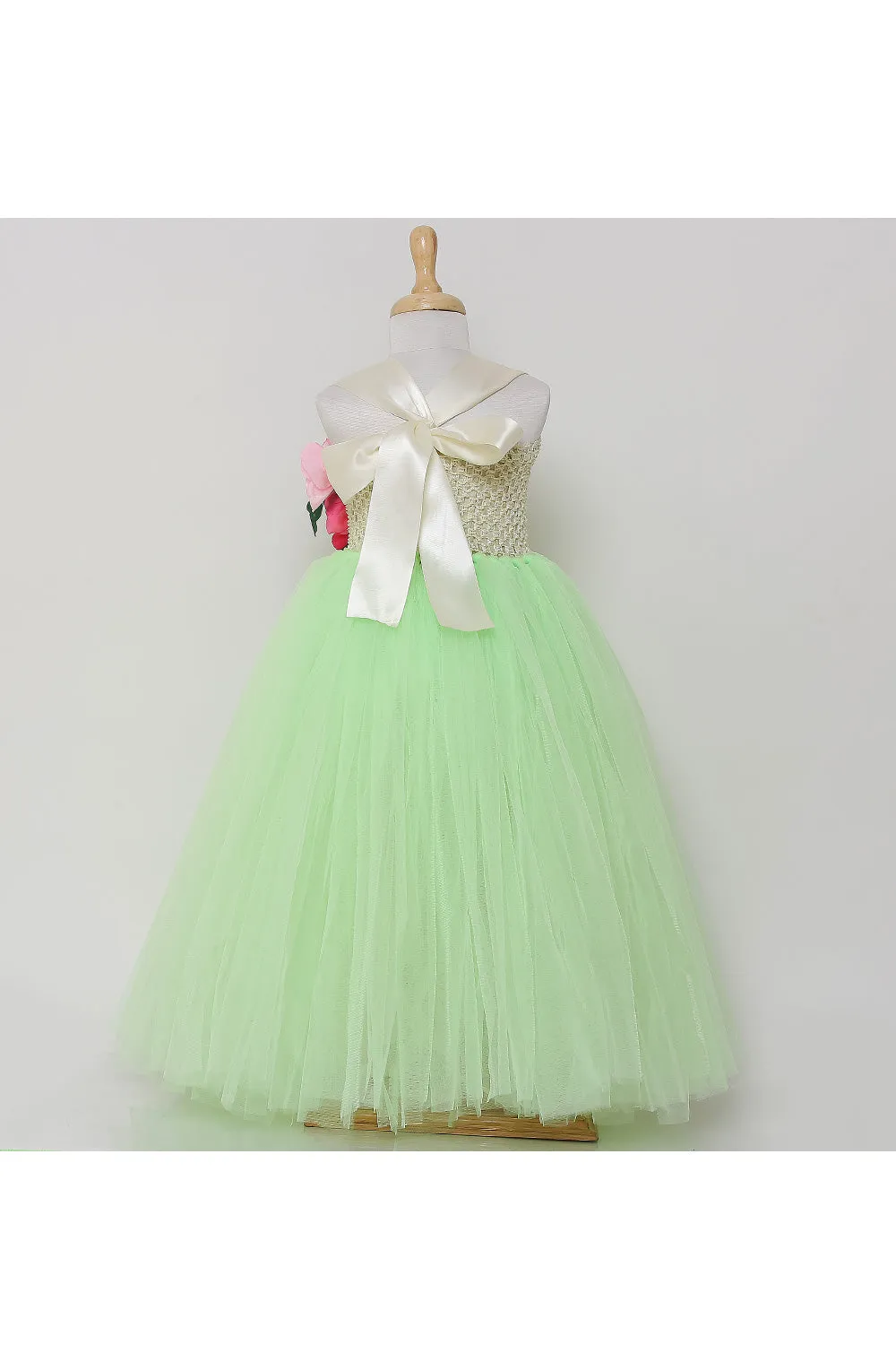 Neon green tutu gown with flowers on one side